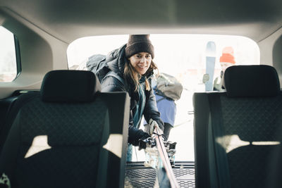 Portrait of man sitting in car