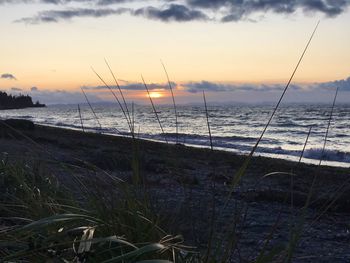 Scenic view of sea against sky during sunset