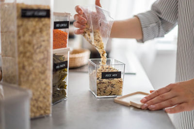 Midsection of woman preparing food on table