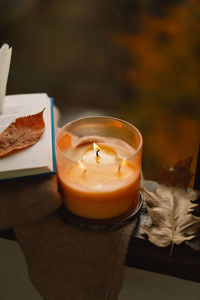 Sweater, candle and autumn decor. autumn home decor.