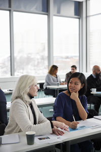 Business people having seminar in office