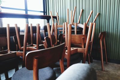 Empty chairs and tables in restaurant