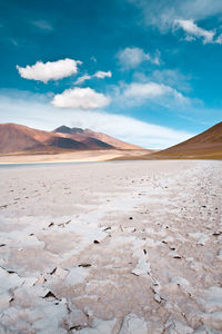 Scenic view of arid landscape against sky