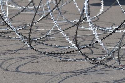 High angle view of barbed wire fence