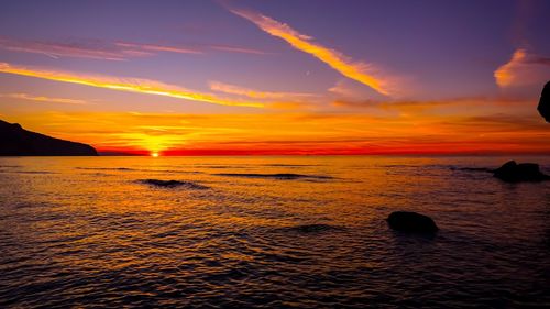 Scenic view of sea against sky during sunset