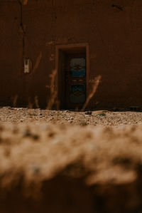 Abandoned building against wall