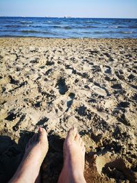 Low section of legs on beach