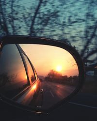 Car on road at sunset