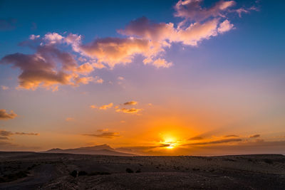 Scenic view of sunset sky over land