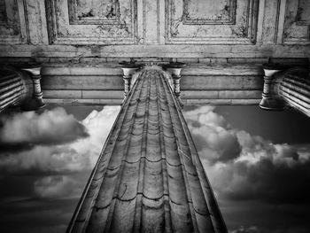 Low angle view of old building against cloudy sky