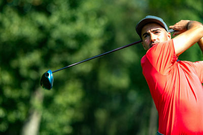 Professional golfer in a swing using a driver golf club