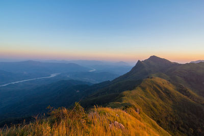 Scenic view of mountains against sky during sunset