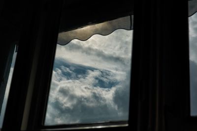 Clouds seen through window
