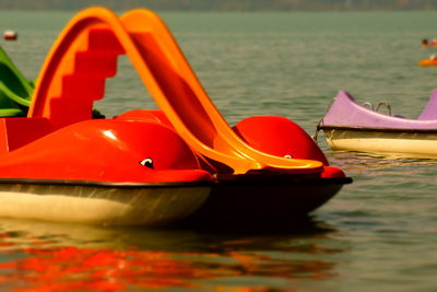 Close-up of red boat in lake