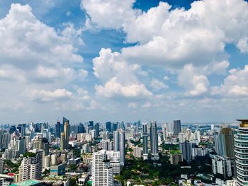 Aerial view of modern buildings in city against sky