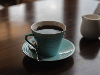 Close-up of coffee cup on table