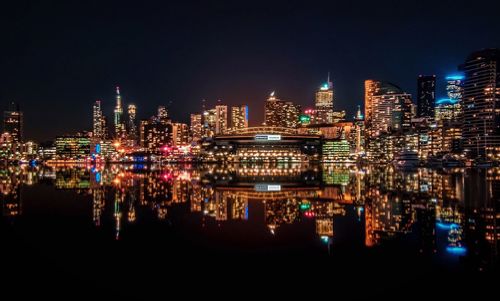 Panoramic view of illuminated buildings in city at night