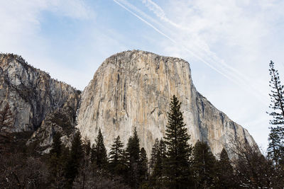Low angle view of rocks against sky