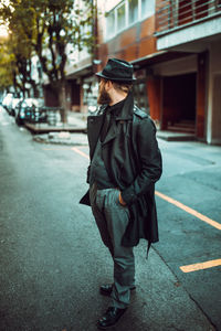 Full length of young man walking on street