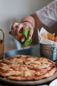 Midsection of woman preparing food