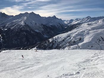 Scenic view of snowcapped mountain against sky