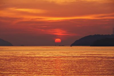 Scenic view of sea against romantic sky at sunset