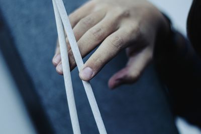 Close-up of hands playing piano