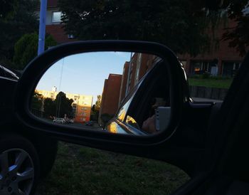 Close-up of side-view mirror of car