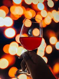 Close-up of hand holding wine glass