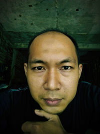Close-up portrait of young man at home