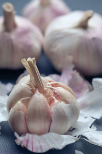 Close-up of garlic bulbs on table