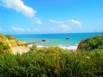 Scenic view of sea against cloudy sky