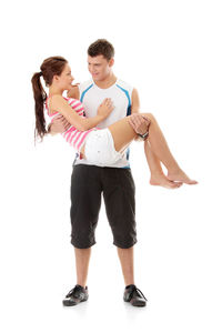 Full length of woman standing against white background