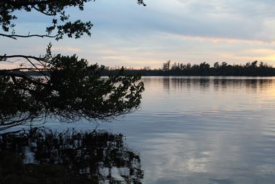 Scenic view of lake at sunset