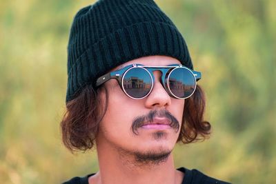 Portrait of young man wearing sunglasses