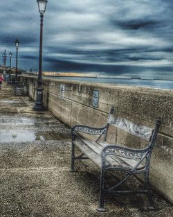 View of empty road against cloudy sky