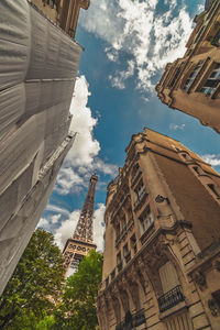 Low angle view of buildings in city against sky