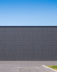 Wall of building against clear blue sky