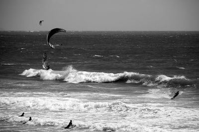 People surfing in sea