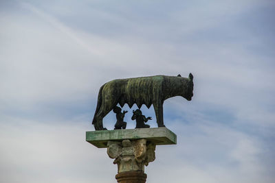 Low angle view of statue against sky