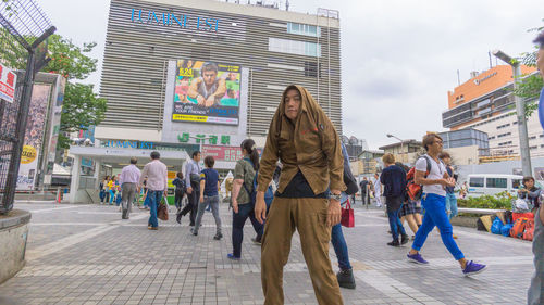 Woman standing in front of building