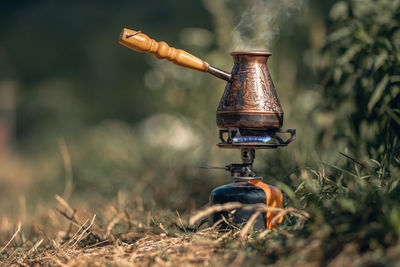 Close-up of hand holding lantern