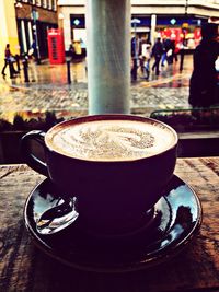 Close-up of coffee cup on table