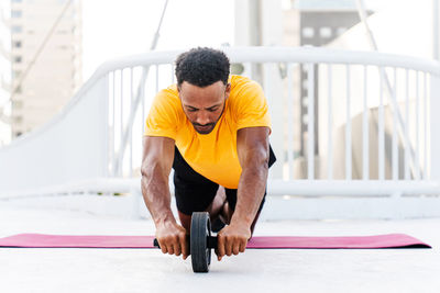 Young woman exercising in gym