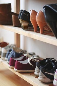 Close-up of shoes and sandals on rack