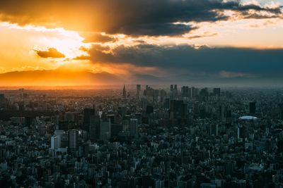 Cityscape against sky during sunset