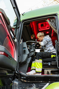 Lorry driver in vehicle cabin