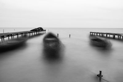 Pier on sea against sky