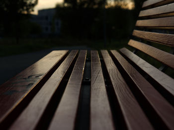 Close-up of wooden bench on table