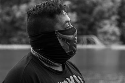 Close-up of man wearing mask outdoors